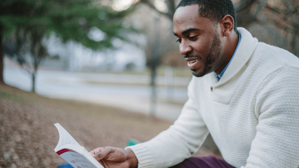 image of a person holding a book