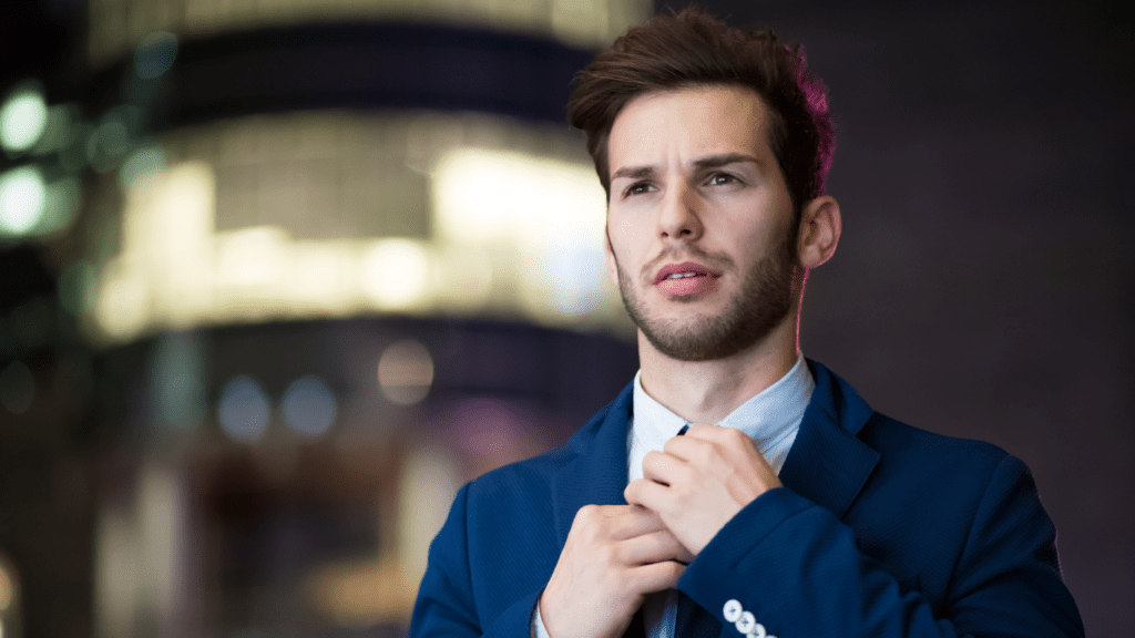 Man standing wearing a blue suit