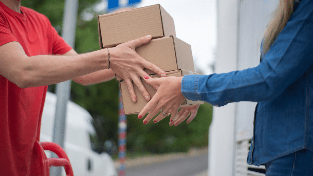 a person handing a package to another person