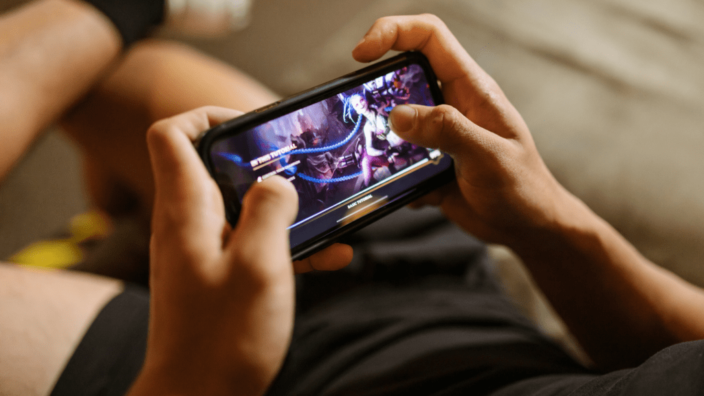 a person is playing a video game on their phone