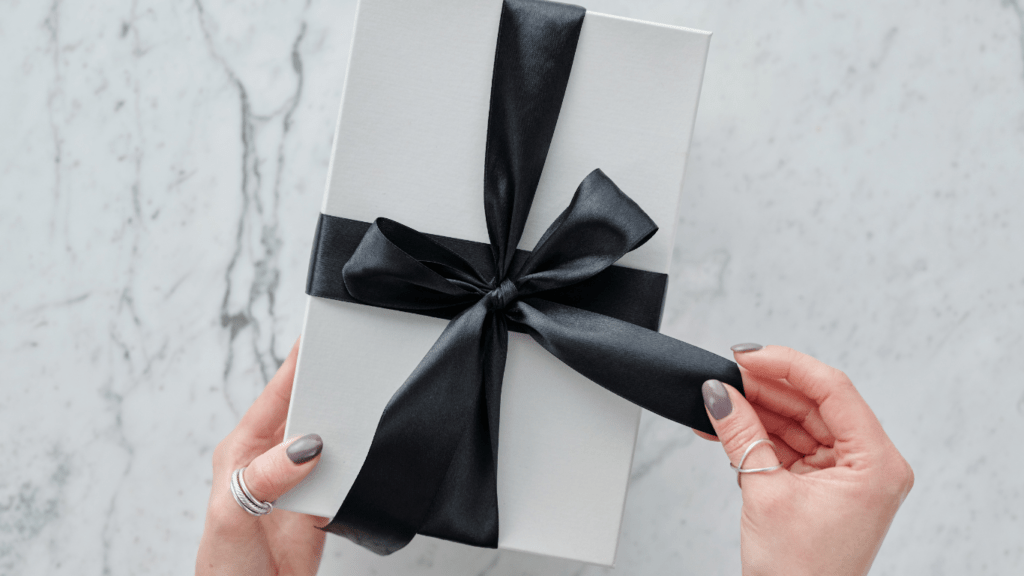 a person holding a gift box