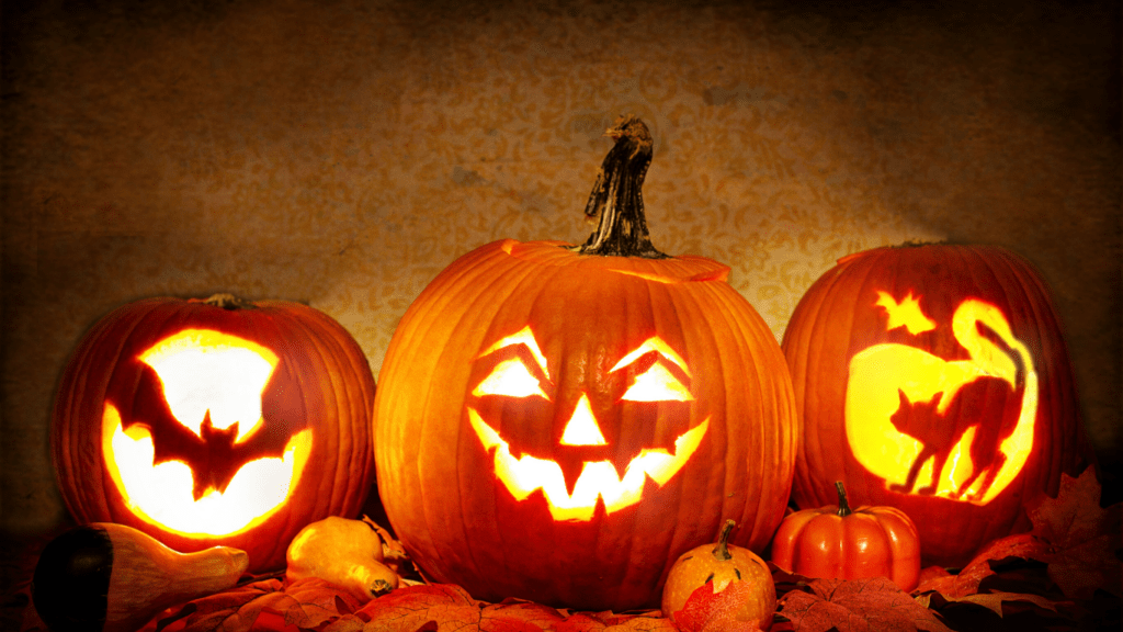 carved pumpkins with halloween faces on them