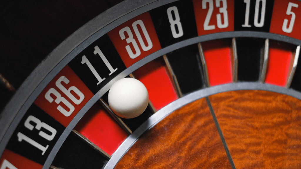 a close up of a roulette wheel on a casino table