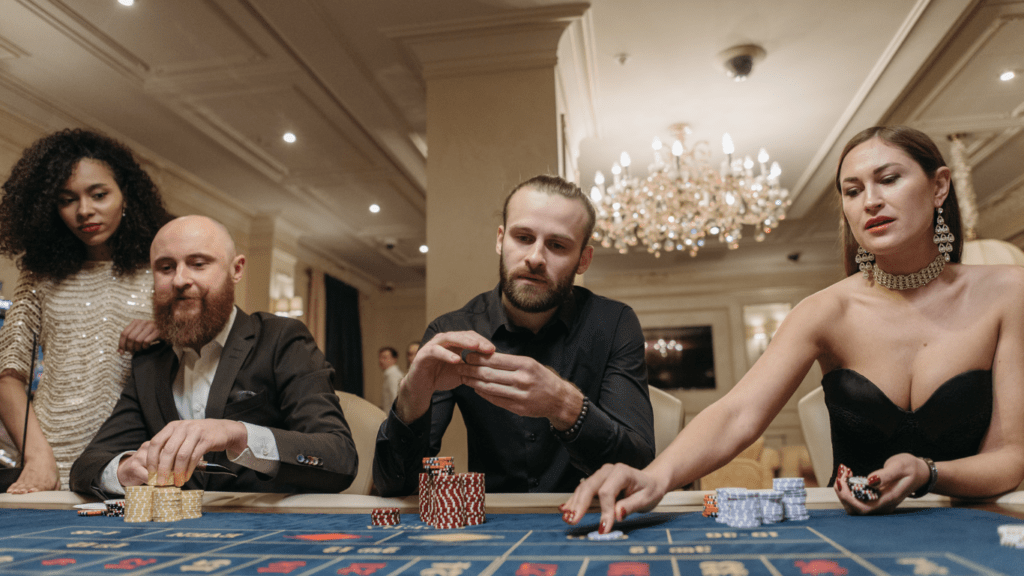 a group of people playing roulette in a casino