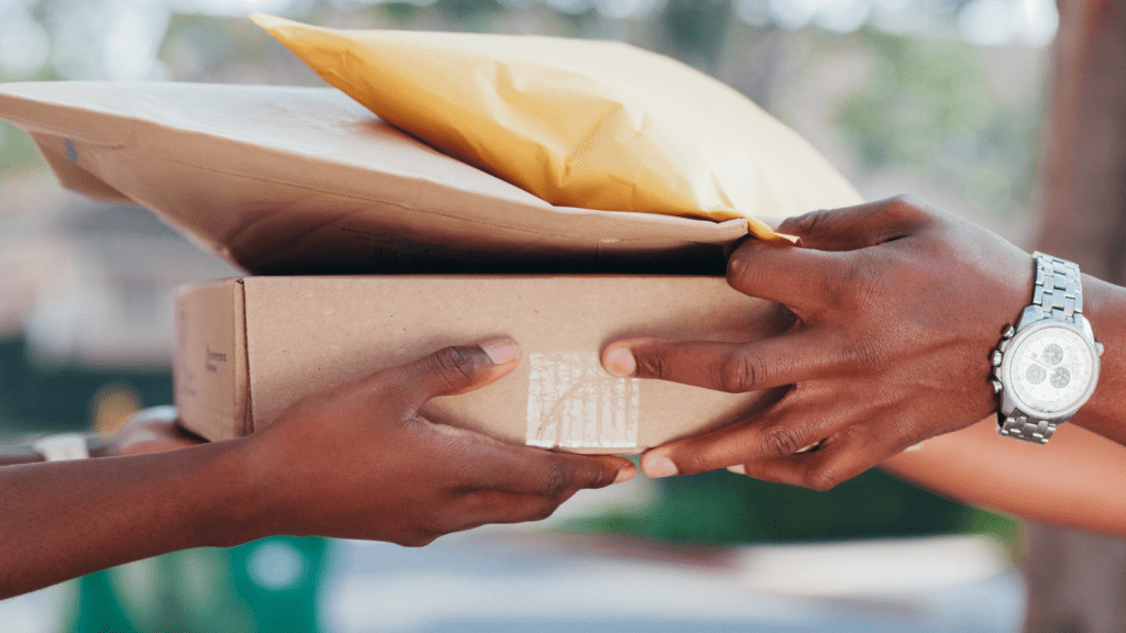 a person handing a package to another person