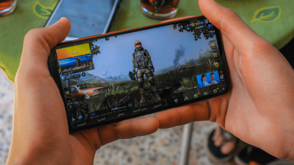 a person is playing a video game on their phone