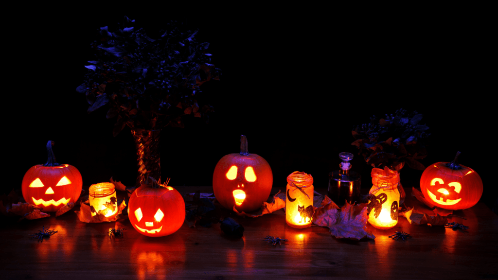  carved pumpkins with halloween faces on them