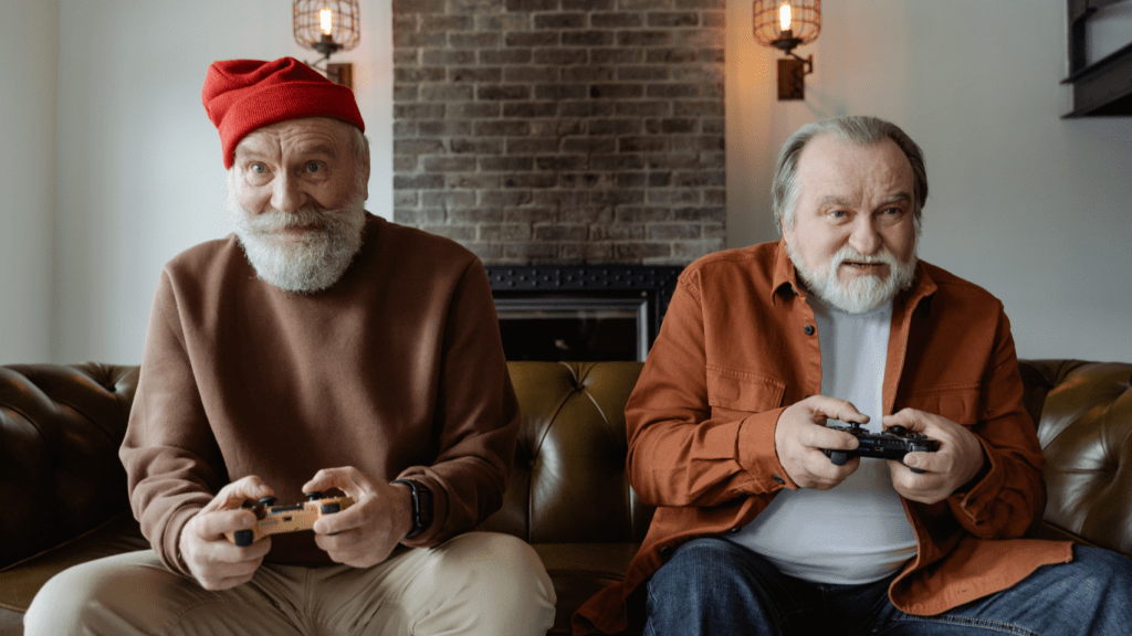 two people sitting on a couch playing video games